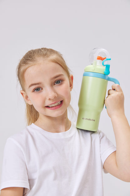 Child holding COMO Ball Tumbler 24oz green - Spring Family Hydration Bundle by COMOBEBE